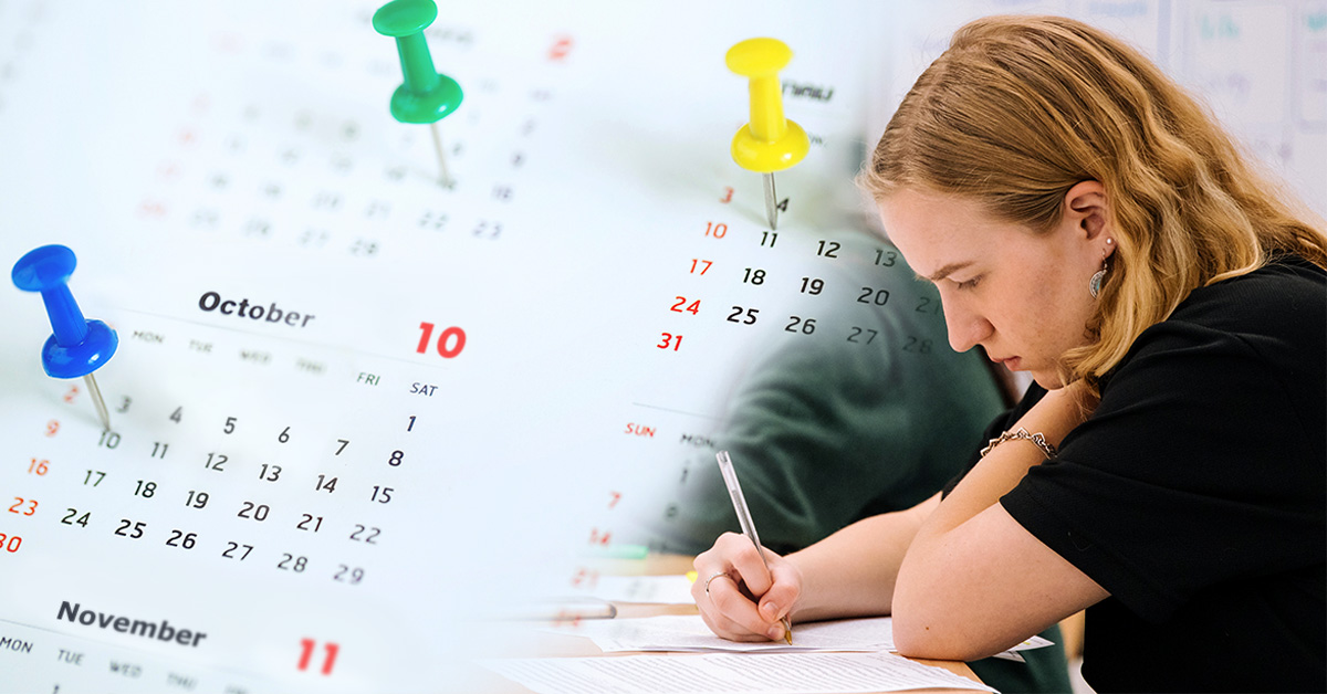 Youth writing on paper on a desk with a collage of calendar and push pins in dates