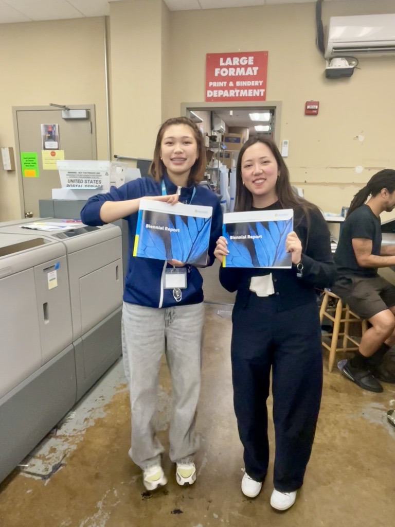 Hot off the press! HumRRO’s Urban Alliance intern, Uji Tsolmonbaatar (left), and Senior Graphic Designer, Rae Powell, hold up copies of the 2023-2024 Biennial Report. Hot off the press! HumRRO’s Urban Alliance intern, Uji Tsolmonbaatar (left), and Senior Graphic Designer, Rae Powell, hold up copies of the 2023-2024 Biennial Report.